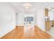 Bright dining room with wood floors and access to a sunroom at 1200 80Th S St, St Petersburg, FL 33707