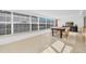 Sunlit dining area with a large table and access to the outdoors at 1200 80Th S St, St Petersburg, FL 33707