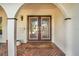 Inviting front entry featuring double doors and brick walkway at 1200 80Th S St, St Petersburg, FL 33707