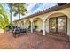 Inviting front entry with brick pavers and arched entryway at 1200 80Th S St, St Petersburg, FL 33707