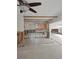A kitchen undergoing renovation, showing exposed framing and new tile flooring at 1200 80Th S St, St Petersburg, FL 33707