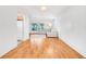 Living area with hardwood floors, a sofa, and access to the kitchen at 1200 80Th S St, St Petersburg, FL 33707