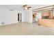 Spacious living room with tile floors and ceiling fan at 1200 80Th S St, St Petersburg, FL 33707