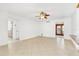 Open living area with tile floors and access to front entry at 1200 80Th S St, St Petersburg, FL 33707