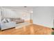 Living room featuring a comfy sectional sofa and wood floors at 1200 80Th S St, St Petersburg, FL 33707