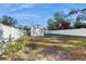 Spacious backyard features a detached garage and a grassy area at 1224 11Th S Ave, St Petersburg, FL 33705