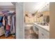 Bathroom with a large vanity, soaking tub, and walk-in closet at 12308 Adventure Dr, Riverview, FL 33579