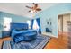 Blue bedroom with king size bed and ensuite bathroom at 12308 Adventure Dr, Riverview, FL 33579