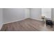 Small bedroom featuring wood floors and a drum set at 12308 Adventure Dr, Riverview, FL 33579