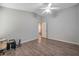 Simple bedroom with wood floors and access to bathroom at 12308 Adventure Dr, Riverview, FL 33579