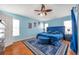 Blue bedroom with king size bed and ensuite bathroom at 12308 Adventure Dr, Riverview, FL 33579