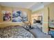 Bedroom with large wave tapestry and built-in shelving at 12308 Adventure Dr, Riverview, FL 33579