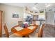 Eat-in kitchen dining area with wood table and four chairs at 12308 Adventure Dr, Riverview, FL 33579