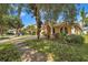 House exterior showcasing landscaping, driveway, and American flag at 12308 Adventure Dr, Riverview, FL 33579