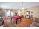 Game room featuring a pool table and hardwood floors at 12308 Adventure Dr, Riverview, FL 33579