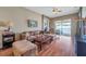 Living room with comfortable seating, coffee table and pool view at 12308 Adventure Dr, Riverview, FL 33579