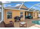 Relaxing pool area with screened enclosure, patio furniture, and a beautiful pool at 12308 Adventure Dr, Riverview, FL 33579