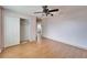 Spacious bedroom with hardwood floors and a large closet at 15406 Peach Stone Pl, Ruskin, FL 33573