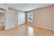 Light and airy bedroom with wood floors and double door closet at 15406 Peach Stone Pl, Ruskin, FL 33573