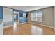 Spacious bonus room with wood floors and large window at 15406 Peach Stone Pl, Ruskin, FL 33573