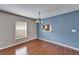 Bright dining area with hardwood floors and a view to kitchen at 15406 Peach Stone Pl, Ruskin, FL 33573