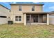 Two-story house with screened patio and backyard at 15406 Peach Stone Pl, Ruskin, FL 33573