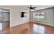 Living room with hardwood floors and a flat-screen TV at 15406 Peach Stone Pl, Ruskin, FL 33573