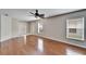 Hardwood floor living room with access to other rooms at 15406 Peach Stone Pl, Ruskin, FL 33573
