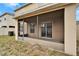 Screened patio with sliding glass doors at 15406 Peach Stone Pl, Ruskin, FL 33573