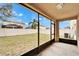 Screened-in patio overlooking a backyard at 15406 Peach Stone Pl, Ruskin, FL 33573