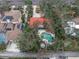 Aerial view of home with pool, surrounded by lush trees at 1545 Park N St, St Petersburg, FL 33710
