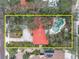 Overhead view of home and pool, nestled amongst mature trees at 1545 Park N St, St Petersburg, FL 33710