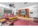 Finished basement recreation room, featuring comfortable seating and an entertainment center at 1545 Park N St, St Petersburg, FL 33710