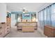 Comfortable bedroom with ceiling fan, neutral carpet, and ample natural light at 1545 Park N St, St Petersburg, FL 33710