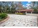 Brick-lined driveway with decorative pavers, leading to home entrance at 1545 Park N St, St Petersburg, FL 33710