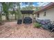 Brick paved patio with covered grill and outdoor seating at 1545 Park N St, St Petersburg, FL 33710