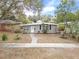 Ranch-style home with a yard and driveway at 1642 49Th N Ave, St Petersburg, FL 33714
