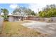 Spacious backyard with a large paved area and grassy lawn at 1642 49Th N Ave, St Petersburg, FL 33714