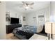 Bedroom with king-size bed, ceiling fan, and private access at 1642 49Th N Ave, St Petersburg, FL 33714