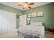 Guest bedroom with a full-size bed and ceiling fan at 1642 49Th N Ave, St Petersburg, FL 33714