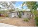 Gray house with walkway and landscaping at 1642 49Th N Ave, St Petersburg, FL 33714