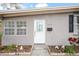 White front door with glass accents and landscaping at 1642 49Th N Ave, St Petersburg, FL 33714