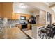 Updated kitchen with granite countertops and stainless steel appliances at 1642 49Th N Ave, St Petersburg, FL 33714