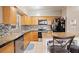 Kitchen features granite countertops, wood cabinets, and stainless steel appliances at 1642 49Th N Ave, St Petersburg, FL 33714