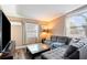 Spacious living room with L-shaped sectional sofa and large TV at 1642 49Th N Ave, St Petersburg, FL 33714