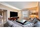 Bright living area with L-shaped sectional sofa and glass coffee table at 1642 49Th N Ave, St Petersburg, FL 33714
