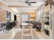 Open living area with glass-top table and built-in shelves at 1642 49Th N Ave, St Petersburg, FL 33714