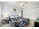 Main bedroom with a king-size bed and ceiling fan at 1642 49Th N Ave, St Petersburg, FL 33714