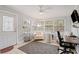Sunroom features comfy seating and a workspace at 1642 49Th N Ave, St Petersburg, FL 33714
