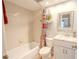 Well-appointed bathroom with tub, shower, and updated vanity at 1673 Nash Ct, Dunedin, FL 34698